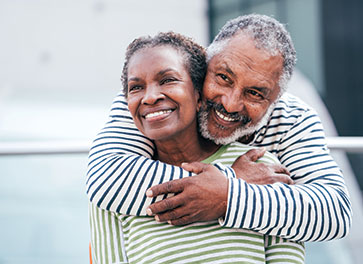 Photo of a couple smiling.