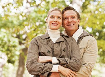 Photo of a couple smiling.